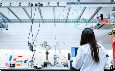 A person working at a computer in a laboratory